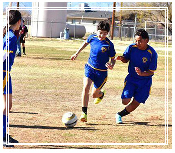 Students playing soccer